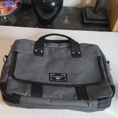 Black And Gray Messenger Bag, Missing Shoulder Strap, By Vangoddy, Front Pocket With Snap Closure, 2 Main Zippered Pockets, One Pocket Has Divider In It. New Without Tags. 19" X 15" X 3" Gray Laptop Bag For Daily Use, Gray Business Bags With Zipper Closure, Gray Shoulder Bag For Business, Gray Business Shoulder Bag, Business Gray Shoulder Bag, Gray Laptop Bags For Everyday Use, Gray Everyday Laptop Bags, Gray Large Capacity Laptop Bag For Everyday Use, Large Capacity Gray Laptop Bag For Everyday