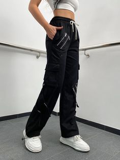 Make a fashion statement with these Zipper Detail Drawstring Cargo Pants. These pants feature a drawstring waist for a comfortable fit and zipper details that add a touch of edgy style. The combination of functionality and fashion makes them a versatile choice for various occasions. Whether you're going for a casual or street-style look, these zipper detail drawstring cargo pants will elevate your outfit. Specifications: Style: Casual Type: Cargo Pants Details: Drawstring, Pocket, Zipper Waist L Black Cargo Pants With Zip Fly For Fall, Techwear Cargo Pants With Zipper For Streetwear, Utility Pants With Zipper Closure For Fall, Sporty Streetwear Pants With Zipper Closure, Trendy Streetwear Cargo Pants With Zipper Closure, Trendy Streetwear Cargo Pants With Zipper, Trendy Black Pants With Zip Fly, Trendy Black Bottoms With Side Zipper, Urban Wide Leg Bottoms With Zipper Closure