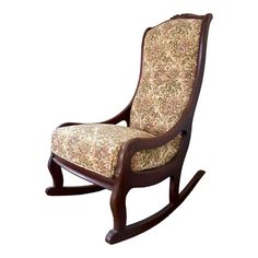 a wooden rocking chair with floral upholstered fabric on it's seat and back