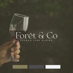 a person holding a wine glass with the words fortet & co on it in front of them