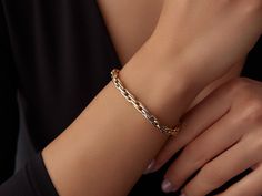 🌟 14K Gold Two Color Link Chain Bracelet 🌟 Make a bold statement with our 14K Gold Two Color Link Chain Bracelet. Featuring interlocking links in both yellow gold and white gold, this bracelet effortlessly combines modern design with timeless elegance. The dual-tone look adds versatility, making it perfect for pairing with any outfit, whether casual or formal. ✨ With an adjustable length from 6 inches to 8 inches, this bracelet ensures a comfortable fit for any wrist. The Two Color Link Chain Modern Chain Link Gold Bracelet, Solid Link Bracelet As A Gift, Gift Bracelet With Solid Link Construction, Gold Cable Chain Bracelet, Solid Link White Gold Chain Bracelet, Formal Tarnish Resistant Chain Bracelet, Polished Chain Bracelet, Cable Chain Bracelets As Gift, Tarnish Resistant White Gold Bracelet