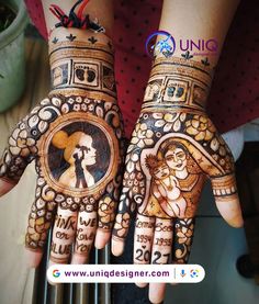 two hands decorated with henna designs and pictures on them, one is holding the other's hand