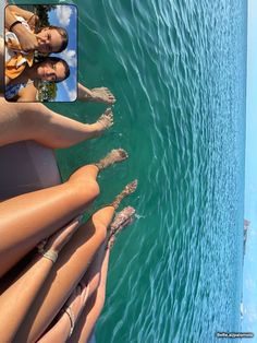 two women are sitting on the back of a boat in the water with their feet up