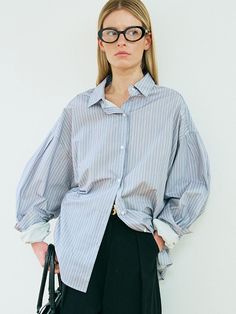 This is a modern and trendy shirt by Oui mais non that are made out of high quality cotton 100% fabric. With unique design detail and trendy mood, it will stand out from your casual daily outfit. - Oversized silhouette- Logo engraved buttons- Back yolk detail- Stripe pattern overall Modern Oversized Shirt For Office, Chic Cotton Shirt With Shirttail Hem, Trendy Cotton Daywear Shirt, Modern Cotton Shirt With Cuffed Sleeves, Oversized Cotton Trendy Blouse, Modern Tops With Cuffed Sleeves, Oversized Trendy Cotton Blouse, Trendy Oversized Cotton Blouse, Trendy Cotton Blouse With Shirttail Hem