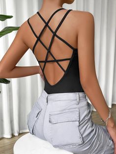 This Criss Cross Backless Cami Bodysuit is the perfect addition to any wardrobe! It features a unique criss-cross back, fringe detailing, and tie-back straps for an eye-catching look. The fabric used is a blend of polyester and spandex which gives it slight stretch while still being lightweight. This bodysuit has a halter neckline and skinny fit that hugs your curves in all the right places. It's also machine washable so you can keep it looking like new with minimal effort. With its fun design a Strappy Bodysuit, Y2k Kawaii, Gothic Emo, Classic Outfit, Cami Bodysuit, Clothing Staples, Ribbed Bodysuit, Womens Bodysuit, Black Bodysuit