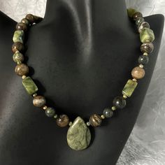 New Handmade Necklace Is Made With Green Serpentine Rectangle Beads, Round Agate Brown Beads, Green And Coral Round Unakite Beads, A Large Russian Serpentine Teardrop Focal Bead, And A Silver-Plated Hook And Eye Clasp With An Extender. This Necklace Measures 17" Long, And The Extender Measures 2-1/2" Long. This Necklace Has A Vintage Boho Retro Look. * This Is A One-Of-A-Kind Necklace. * There May Be Some Color Discrepancies Due To Different Monitor Settings. The Colors Are Described As Clearly Green Wood Bead Necklace, Earthy Boho Jewelry, Big Beaded Jewelry, Earth Tone Necklace, Earthy Beaded Jewelry, Brown Bead Necklace, Vintage Jewelry Necklaces, Big Beaded Necklace, Funky Beaded Necklace