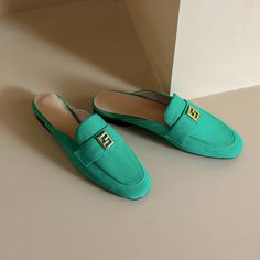 Green mules are totally unique. With suede upper and classic loafer style. these flat mules are stylish and will be amazing if you pair them with white pants. Upper: Suede Lining: Genuine Leather Outsole: Rubber Toe: Round Toe Closure: Slip on Color: Green. Beige is_handmade: Yes Elegant Green Slip-on Mules, Summer Slip-on Office Loafers, Summer Workwear Flat Slip-ons, Trendy Flat Heel Mules For Fall, Classic Suede Mules For Spring, Chic Slip-on Flat Slippers, Chic Green Mules For Formal Occasions, Chic Round Toe Mules For Office, Trendy Closed Toe Office Mules