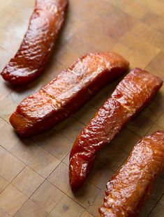 some sausages are on a cutting board ready to be cooked