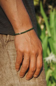 A handcrafted bracelet featuring 4mm Jade beads. Accented with a sterling silver bead and finished with a solid silver clasp, this piece adds a subtle pop of color to any stack. Sterling Silver Jade 4mm Thickness Swivel Clasp Handcrafted in LA Jade: Balance, Prosperity, Protection, Vitality Determining your bracelet size: Encircle your wrist with a flexible tape measure and record the measurement. Add 1/2 to 1 inch to your wrist measurement for a comfortable bracelet fit. Choose the closest stan Minimalist Rondelle Gemstone Beaded Bracelets, Classic Beaded Bracelets With Sterling Silver Clasp As Gift, Minimalist Hand-strung Rondelle Beaded Bracelets, Minimalist Hand-strung Rondelle Bracelets, Minimalist Hand-strung Beaded Bracelets For Meditation, Minimalist Single Strand Beaded Bracelets With Round Beads, Minimalist Sterling Silver Beaded Bracelet With Gemstones, Beaded Bracelets With Sterling Silver Clasp As Gift, Minimalist Single Strand Beaded Bracelets