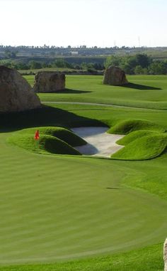 a person on a golf course about to hit the ball