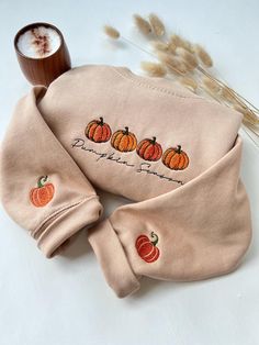 🎃 Pumpkin Season Embroidered Sweatshirt With Embroidered Sleeves - Cozy Fall Vibes 🎃 🍁 Embrace the beauty of autumn with this soft and stylish sweatshirt, featuring a charming Pumpkin Season embroidered design. Perfect for cozy nights, fall adventures, or pumpkin patch visits, this sweatshirt is a must-have for pumpkin lovers and fall enthusiasts alike! 🍂 Product Highlights: 🧡 High-quality embroidery: Features four adorable pumpkins with a handwritten "Pumpkin Season" design, and cute embro Long Sleeve T-shirt With Embroidered Graphics For Fall, Long Sleeve Top With Letter Embroidery For Fall, Fall Long Sleeve Sweatshirt With Custom Embroidery, Embroidered Long Sleeve Sweatshirt For Fall, Custom Embroidery Long Sleeve T-shirt For Fall, Fall Crew Neck Hoodie With Letter Embroidery, Crew Neck Top With Custom Embroidery For Fall, Halloween Embroidered Crew Neck Hoodie, Halloween Long Sleeve Sweatshirt With Custom Embroidery