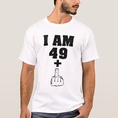 a man wearing a white t - shirt with the words i am 29 plus on it