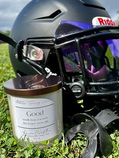 a helmet and other items sitting in the grass