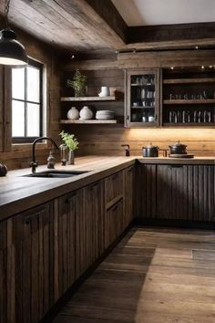 a kitchen with wooden walls and flooring, an island countertop and cabinets in the middle