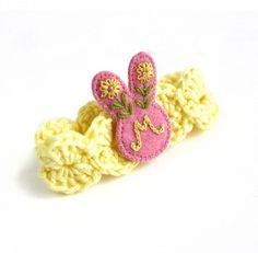 a crocheted hair clip with an embroidered bunny on it