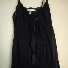 Used,Not New,Never Worn Black Chemise Nightgown By Victoria Secret. Front Is Lace& Back Is Semi Sheer That Wraps Around The Front And Ties In A Satin Bow. Very Unique Night Time Piece. Size Is Medium Black Bedtime Dress For Spring, Black Camisole Sleepwear For Spring, Black Spring Nightgown For Bedtime, Black Spring Dress For Bedtime, Black Camisole Nightgown For Loungewear, Black Spring Nightgown For Sleep, Black Lace Trim Sleepwear For Spring, Victoria's Secret Camisole Nightgown With Lace Trim, Black Lace Trim Sleepwear For Summer