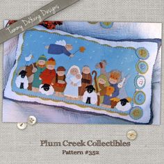 an image of a needled nativity scene on a pillow with the words plan creek collectibles written below it