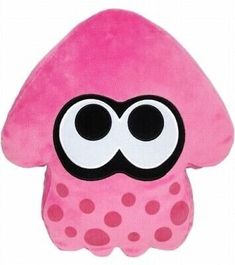 a pink stuffed animal with big eyes and polka dots on it's back end