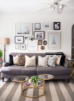 a living room filled with lots of furniture and pillows on top of it's couches