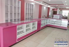 a pink and white display case in a store