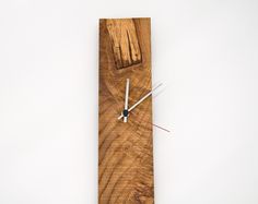 a clock made out of wood on a white background