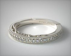 the wedding band has been made with white gold and is set with round brilliant cut diamonds