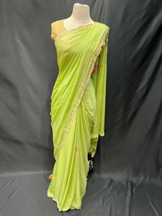 Elevate your style with our Party Wear Saree D-230! Adorned with exquisite pearl work, this saree will add a touch of elegance to any special occasion. Stand out in a crowd and feel confident in this stunning piece. Make a statement, get your Party Wear Saree D-230 today! Pista Green Pre-draped Saree With Mirror Work For Navratri, Elegant Resham Embroidered Slub Silk Pre-draped Saree, Elegant Slub Silk Pre-draped Saree With Resham Embroidery, Elegant Sharara With Mirror Work In Slub Silk, Elegant Slub Silk Sharara With Mirror Work, Bollywood Style Slub Silk Saree For Reception, Navratri Party Slub Silk Sharara, Designer Chanderi Pre-draped Saree In Pista Green, Navratri Party Sharara In Slub Silk