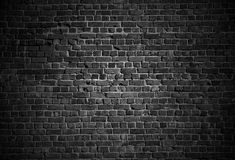 black and white brick wall with light coming from the top stock photo - 1387982