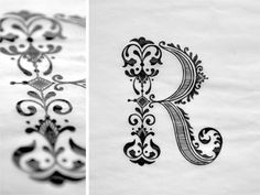 the letter r is made up of black and white designs on paper, which are printed with