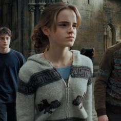 the cast of harry potter and hermione's hogwarts is walking in front of an old building