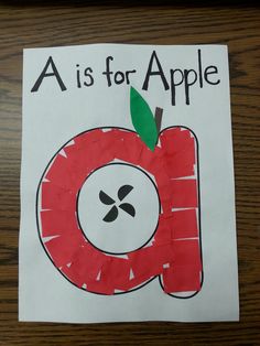 a is for apple handprinted on paper with the letter o in front of it