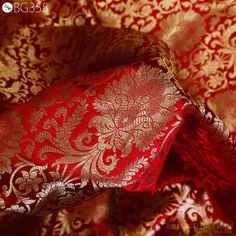 Brocade Fabric Banarasi Brocade Fabric by the Yard Banarasi Brocade Red Gold Weaving for Wedding Dress Home Decor Indian Art Blended Silk. This is a beautiful heavy benarse blended silk brocade floral design fabric in Red and Gold. The fabric illustrate golden woven beautiful design on Red background. ➤Fabric Type: Blended Silk (Viscose and Silk) Fine quality Zari Brocade Weaving from Banarasi. ➤ Code: bg355 ➤ Color: Red and Gold. ➤ Listing: By 1 Yard of fabric.  ➤ Width of the fabric is 44 inches. ➤ Care: Dry Clean Only Fabric Type: Blended Silk (Viscose and Silk) Super Fine Quality Brocade Weaving from Banarasi, which is known as "Kimkhab". During the Mughal period (1556-1707), when kimkhwāb was extremely popular with the rich, the great centres of brocade weaving were Benares (Vārānasi) Brocade Traditional Drape Wear For Wedding, Brocade Traditional Wear For Wedding, Brocade Saree With Pallu For Wedding, Elegant Red Traditional Wear With Zari Weaving, Elegant Red Traditional Wear With Motifs, Red Brocade Saree For Wedding, Wedding Brocade Saree With Pallu, Red Traditional Wear With Motifs For Wedding, Elegant Red Dupatta With Traditional Patterns