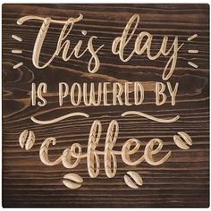 this day is powered by coffee sign on wooden background with hand drawn lettering and wood grains