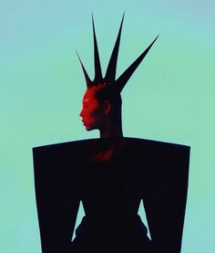 a woman's head with spikes on it is silhouetted against a blue background