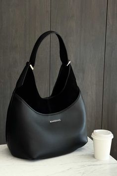 The Kaia Black by Nakedvice is a women's leather handbag crafted from smooth leather and suede. It's rounded shape, multiple compartments and contrast fabric makes The Kaia the perfect everyday black handbag. 
 Colour: BLACK/SILVER Cheap Elegant Baguette Shoulder Bag, Lulus Black Handbag, My Style Bags, Colorful Handbags, Fall Bags, Everyday Handbag, Girly Bags, Black Handbag, Fancy Bags