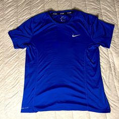 Brand New Sporty Blue Shirt For Sports, Blue Moisture-wicking Short Sleeve Shirt, Blue Short Sleeve Sports Shirt, Blue Go-dry T-shirt For Gym, Blue Go-dry T-shirt For Workout, Blue Go-dry Workout T-shirt, Functional Blue Go-dry Tops, Blue Functional Go-dry Tops, Nike Blue Workout Top