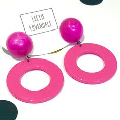 Fuchsia or hot pink Go-Go hoop drops from vintage aura glow lucite studs. Geometric lucite earrings made with vintage parts. These are big & make a statement. Mod meets 80's opulence. Measures just under 2.25" or 60mm from top to bottom, but super lightweight with just enough swing to make a statement. Earrings are made with vintage lucite parts that were made in Rhode Island in the 1960's - early 80's by Best Plastics. We hand-set them with surgical steel earring posts and they have sturdy surg Retro Pink Earrings For Party, Retro Pink Party Earrings, Bold Pink Earrings For Party, Bold Pink Party Earrings, Retro Pink Drop Earrings, Lucite Earrings, Surgical Steel Earrings, Earring Posts, Vintage Lucite