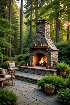 an outdoor fireplace in the middle of a forest