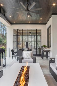 an outdoor living room with a fire pit