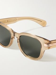 Simple and timeless, Gucci Eyewear's sunglasses are made from translucent acetate in a classic D-frame shape. The hinges are detailed with gold-tone hardware that sleekly extends onto the temples. Gucci Tinted Sunglasses For Formal Occasions, Classic Acetate Sunglasses For Formal Occasions, Formal Gucci Sunglasses With Glass Lenses, Classic Clear Sunglasses For Formal Occasions, Classic Gucci Sunglasses, Classic Gucci Sunglasses With Tinted Lenses, Gucci Classic Sunglasses With Tinted Lenses, Trendy Gucci Acetate Sunglasses, Luxury Clear Gucci Sunglasses