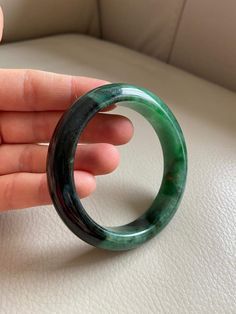 "🌈 Jade Bangle 59.7mm (2.35\"), Round Shape, Green & Light Green 🌷 Untreated Natural Jadeite/ Grade A Jade 🌷 Certification : Yes 🌷 Jade from Myanmar/ Burma 🌷 Shape : Round 🌷 Inner diameter : 59.7mm / 2.35\" 🌷 Width & Thickness : 14.2 x 8.8mm 🌷 Color : Green & Light Green 🌷 Free standard shipping from Hong Kong with tracking included 🌷 Take approximately 7-21 days to arrive worldwide ❤️ In Chinese Culture: Young people wear jade pendant will have a prosperous life, attracts Spiritual Round Bangle With Natural Stones, Jade Gemstone Bangle Bracelet, Affordable Jade Bangle Jewelry, Luxury Green Jade Bangle, Handmade Round Jade Bangle, Adjustable Green Jade Bangle, Hand-strung Round Jade Bracelets, Jade Bracelet Bangles Chinese, Hand-strung Green Jade Jewelry