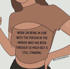 a woman wearing a brown shirt with writing on her chest and the words work on being in love with the person in the mirror who has been through so much but is still standing