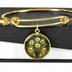 "Celebrate the essence of a March birthday with our exquisite Daffodil Bracelet, a piece of Birth Flower Jewelry that perfectly captures the beauty of the Birth Month Flower in an 18K Gold Bracelet, intricately designed for those born under the summer sun; this Birthflower Bracelet not only symbolizes hope & creativity associated with daffodil but also adds an elegant botanical touch to any jewelry collection, making it an ideal gift for anyone who cherishes the unique charm of personalized, bot Gold Flower-shaped May Birthstone Jewelry, Gold Bracelet With Birth Flower Design, Elegant Yellow Flower Bracelets, Gold Flower Jewelry For May Birthstone, Elegant Yellow Flower Bracelet, Gold Flower-shaped Bracelets For Mother's Day, Gold Flower-shaped Bracelet For Mother's Day, Gold Bracelet For May Birthstone Gift, Gold Bracelets With Flower Shape For Mother's Day