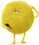 a yellow stuffed animal with one eye and two hands on his hips, standing in front of a white background