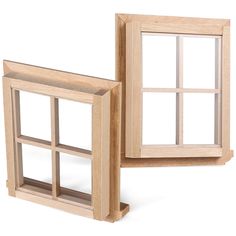 two wooden windows sitting side by side on top of each other in front of a white background