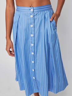 A classic button down, pleated midi skirt with a defined waist and the ultimate feminine vibes. Pairs well with a white tee and whatever your weekend plans are… (This one comes in Day Trader.) | Women's Idra Skirt in Day Trader | Ethical Essentials Feminine Vibes, Defined Waist, Pleat Skirt, Day Trader, Weekend Plans, Pleated Midi Skirt, White Tee, Pleated Skirt, Midi Skirt