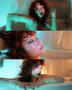 a woman laying in a bathtub with green light on her face and hands behind her head