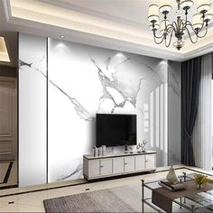 the living room is decorated in white marble