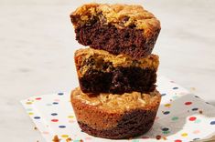 three chocolate chip muffins stacked on top of each other