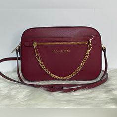 Michael Kors Jet Set Crossbody Bag Color Is Burgundy Tan Color Interior Size Is Medium Gold Toned Hardware Top Close Zipper Adjustable Strap New With Tags Michael Kors Burgundy Bags With Branded Hardware, Burgundy Crossbody Shoulder Bag With Branded Hardware, Michael Kors Burgundy Bag, Burgundy Crossbody Bag With Chain Strap, Navy Crossbody Bag, Travel Clutch, Michael Kors Selma, Color Interior, Best Purses